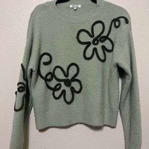 Trendy H&M Green Sweater with Black Floral Design